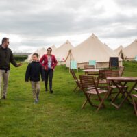 Guests arriving at Glamping Wales Bell Tent Village